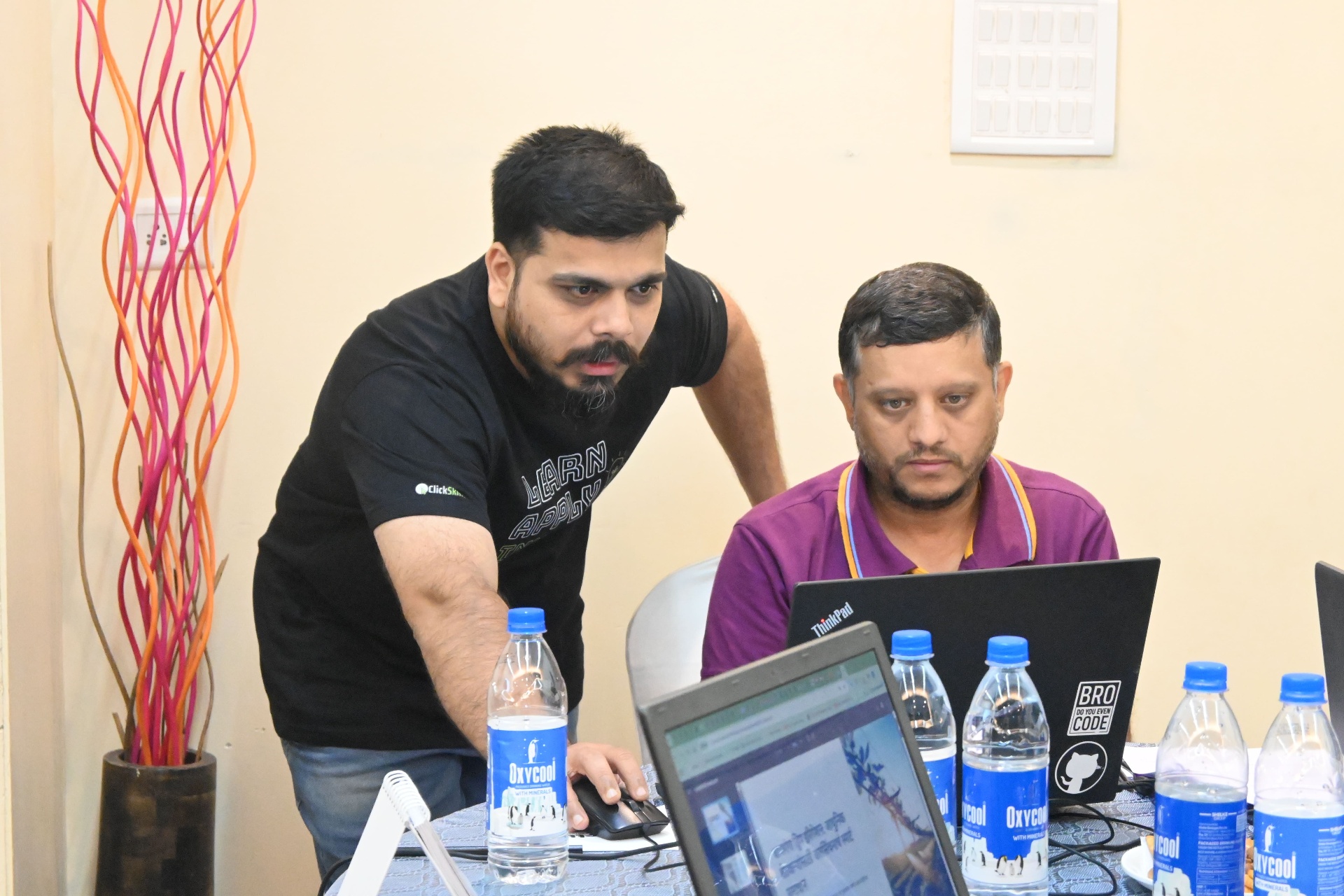Two participants working together on coding